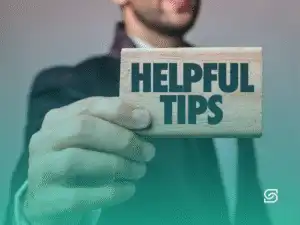 Business professional holding a sign that says 